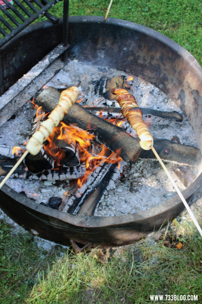 Cinnamon Rolls on a Stick over a Campfire